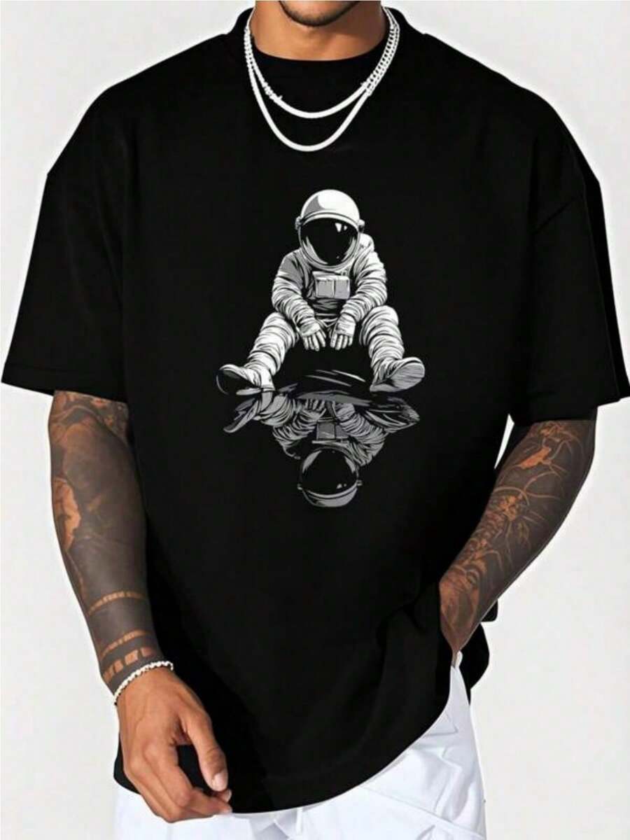 A Graphic Illustration Of An Astronaut On A T-Shirt, Perfect For Men. This Casual Short-Sleeve T-Shirt Is Soft, Comfortable, And Machine Washable, Making It Ideal For Everyday Wear Or As A Unique Gift. Suitable For All Seasons. - Back - View 1