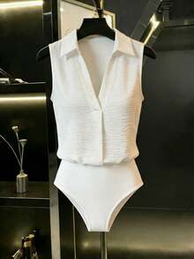 Mono blanco holgado sin mangas con cuello de camisa y escote en V, de tela arrugada, estilo casual, minimalista y de vacaciones, mono de una sola pieza, nueva llegada 2026 - Blanco - Ver 1
