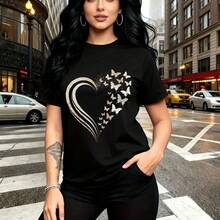 Camiseta de mujer con estampado artístico de corazón rompiéndose en mariposas blancas y brillos - camiseta casual de manga corta con cuello redondo, ajuste cómodo y estilo urbano moderno - ideal para paseos por la ciudad, salidas diarias y regalo per - Negro - Ver 1