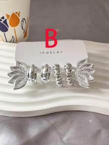 Conjunto de aretes con diseño de flor y gota en tono plateado metálico, versátil y favorecedora - Plateado - Ver 10