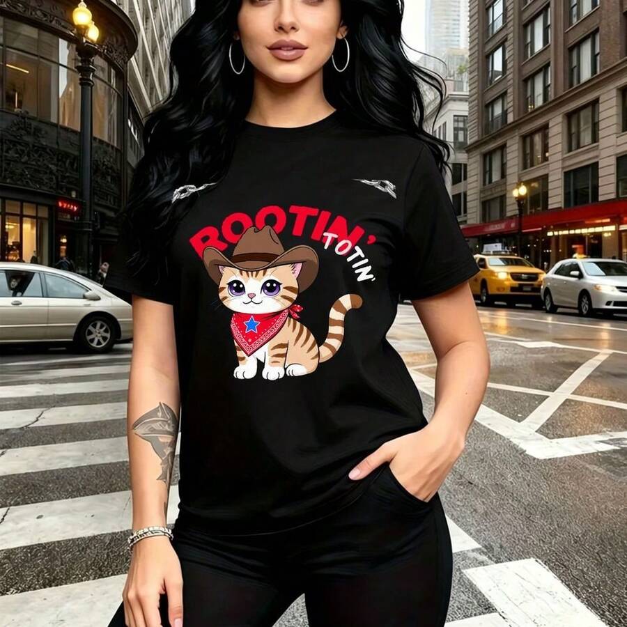 Camiseta de mujer con estampado de gato cartoon vaquero con sombrero y pañuelo rojo y texto "ROOTIN' TOOTIN'" - camiseta casual de manga corta, ajuste cómodo y fresco, estilo urbano divertido - ideal para paseos por la ciudad, compras y regalo perfec - Negro - Ver 1
