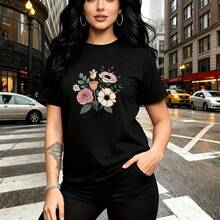 Camiseta de mujer con estampado floral vibrante de rosas y margaritas en fondo negro, diseño elegante con lazo - camiseta casual de manga corta, ajuste cómodo y fresco, estilo urbano moderno para calles de la ciudad - ideal para uso diario, paseos po - Negro - Ver 7