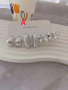 Conjunto de aretes con diseño de flor y gota en tono plateado metálico, versátil y favorecedora - Plateado - Ver 8