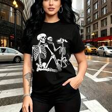 Camiseta de mujer con estampado de tres calaveras bailando en estilo urbano y alternativo - camiseta holgada de manga corta con cuello redondo, ajuste cómodo y fresco ideal para el clima cálido - perfecta para paseos por la ciudad, salidas casuales o - Negro - Ver 9