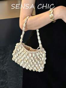 Sac à main crocheté recouvert de coquillages, léger et respirant, design unique et inspiré du style bohème. Facile à assortir avec des robes d'été, des tenues en lin et des tenues de soirée. Parfait pour les brunchs, les événements en plein air et les sorties en vacances. - Blanc - Voir 1