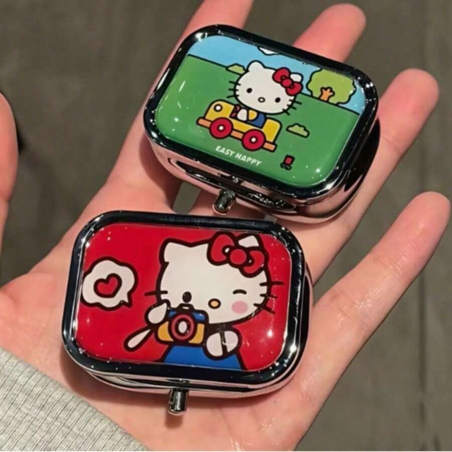 Caja de almacenamiento plana dividida de dibujos animados Sanrio Hello Kitty, almacenamiento portátil de aretes con espejo incorporado, caja portátil mini linda a prueba de humedad y sellada, adecuada para viajes y uso al aire libre, tema de dibujos animados divertido, a prueba de humedad y sellada, fácil y rápida de abrir, diseño de múltiples compartimentos, adecuada para viajes y almacenamiento de medicamentos, caja dispensadora de pastillas portátil mini para tres comidas al día, sellada a prueba de humedad con 2 compartimentos - Caja de almacenamiento de pastillas de moda, portátil para viajes y uso diario - Regalo ideal para mujeres, hombres o ideas creativas únicas, caja de pastillas - Ver 1