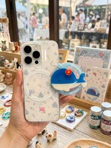 1個可愛鯨魚設計磁吸式可調手機支架，相容 Apple 與 Android 裝置。這款手機架是送給家人和朋友的絕佳禮物，非常適合春夏季外出或生日。此配件還可作為可伸縮手機握把，實用且便攜。 - 彩色 - 查看 5
