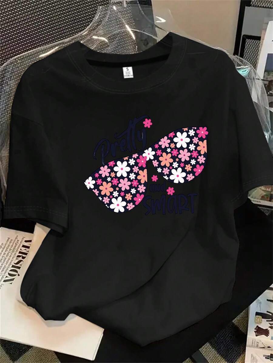 Top de manga corta con cuello redondo para mujer y unas gafas de sol con estampado floral, aptas para todas las estaciones. - Negro - Ver 1