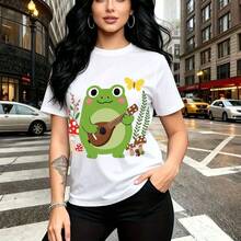 Camiseta de mujer con estampado de rana verde tocando ukelele entre setas y mariposas - diseño whimsical y colorido, ajuste cómodo para el día a día, estilo urbano casual - ideal para paseos por la ciudad, días lluviosos o como regalo perfecto para m - Blanco - Ver 1
