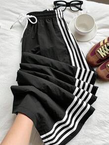 2026 Nuevo Pantalones deportivos casuales de mujer con raya lateral amarilla, cintura elástica y corte holgado, adecuados para primavera/verano, Navidad, Y2K, salidas casuales de Año Nuevo - Blanco y Negro - Ver 1