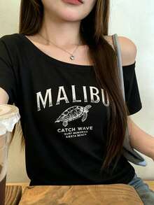 時尚女款露肩短袖T恤，裝飾馬里布海龜圖案，聚酯纖維高彈性修身下擺上衣 - 黑色 - 查看 1