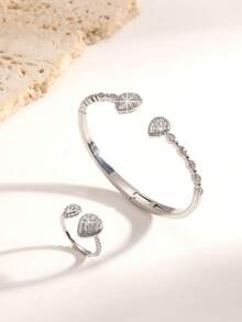 Un conjunto de joyería de lujo ligero, elegante y exquisito, chapado en oro y plata, densamente incrustado con gotas de agua del tamaño de diamantes, un conjunto de brazalete y anillo decorativo de circonita, adecuado para fiestas de gala, uso diario y regalos de vacaciones para mujeres. - Gotas de agua dobles, grandes y pequeñas - Ver 6