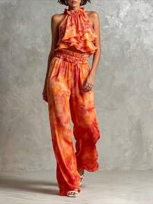 Conjunto elegante de dos piezas para mujer: top corto halter con estampado tie-dye y pantalones de pierna ancha. Un atuendo casual y fluido ideal para festivales. - Naranja - Ver 1
