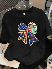 Top de mujer de manga corta y cuello redondo con estampado de globos que incluye la estatua de la libertad y la bandera estadounidense, apto para todas las estaciones. - Negro - Ver 1