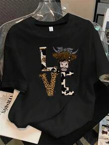 Top de mujer de manga corta y cuello redondo con estampado de vaca y lazo en la cabeza, apto para todas las estaciones. - Negro - Ver 1