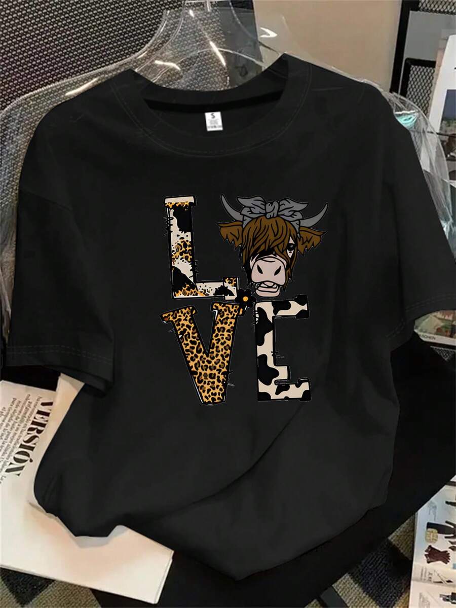 Top de mujer de manga corta y cuello redondo con estampado de vaca y lazo en la cabeza, apto para todas las estaciones. - Negro - Ver 1