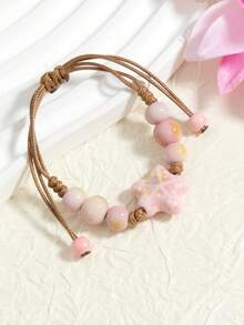 1 pieza Brazalete de cerámica con forma de estrella de mar ajustable hecho a mano, estilo de playa y océano, cuerda tejida a mano (el color y el patrón de la cerámica pueden variar ligeramente debido a la diferencia de temperatura durante el proceso de cocción) - rosa - Ver 4