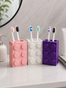 1 pieza Soporte para cepillo de dientes de bloque de construcción creativo y lindo, estantería de almacenamiento multifuncional todo en uno para el baño, diseño de bloque colorido y divertido con vaso minimalista para pasta de dientes, llamativo y personalizado, colocación firme en el mostrador del tocador o el lavabo, organiza ordenadamente los cepillos de dientes, la pasta de dientes y otros artículos de tocador, mantiene las cosas limpias y ordenadas, combina el almacenamiento práctico con la decoración del baño, crea un espacio de baño fresco y saludable - Multicolor - Ver 1