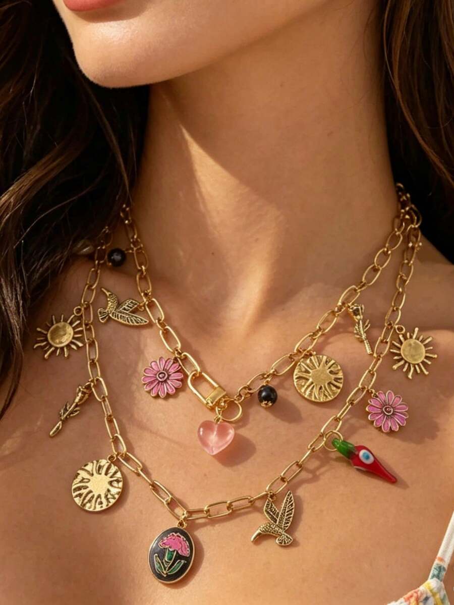 Retro Y2K Layered Necklace. Its Paperclip Chains In Gold And Silver Tones Are Adorned With Pendants Of Sunflowers, Hearts, Little Birds And Flowers. This Mixed-Style Piece Is Perfect For Summer Getaways And Daily Street Looks.