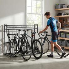 4-Bike Garage Floor Rack Adjustable Slots Anti-Tip Storage Organizer With Gear Basket For Indoor Outdoor - Black - View 1