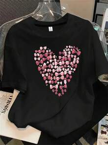Top de mujer de manga corta y cuello redondo con estampado de corazones rosas, ideal para todas las estaciones. - Negro - Ver 1