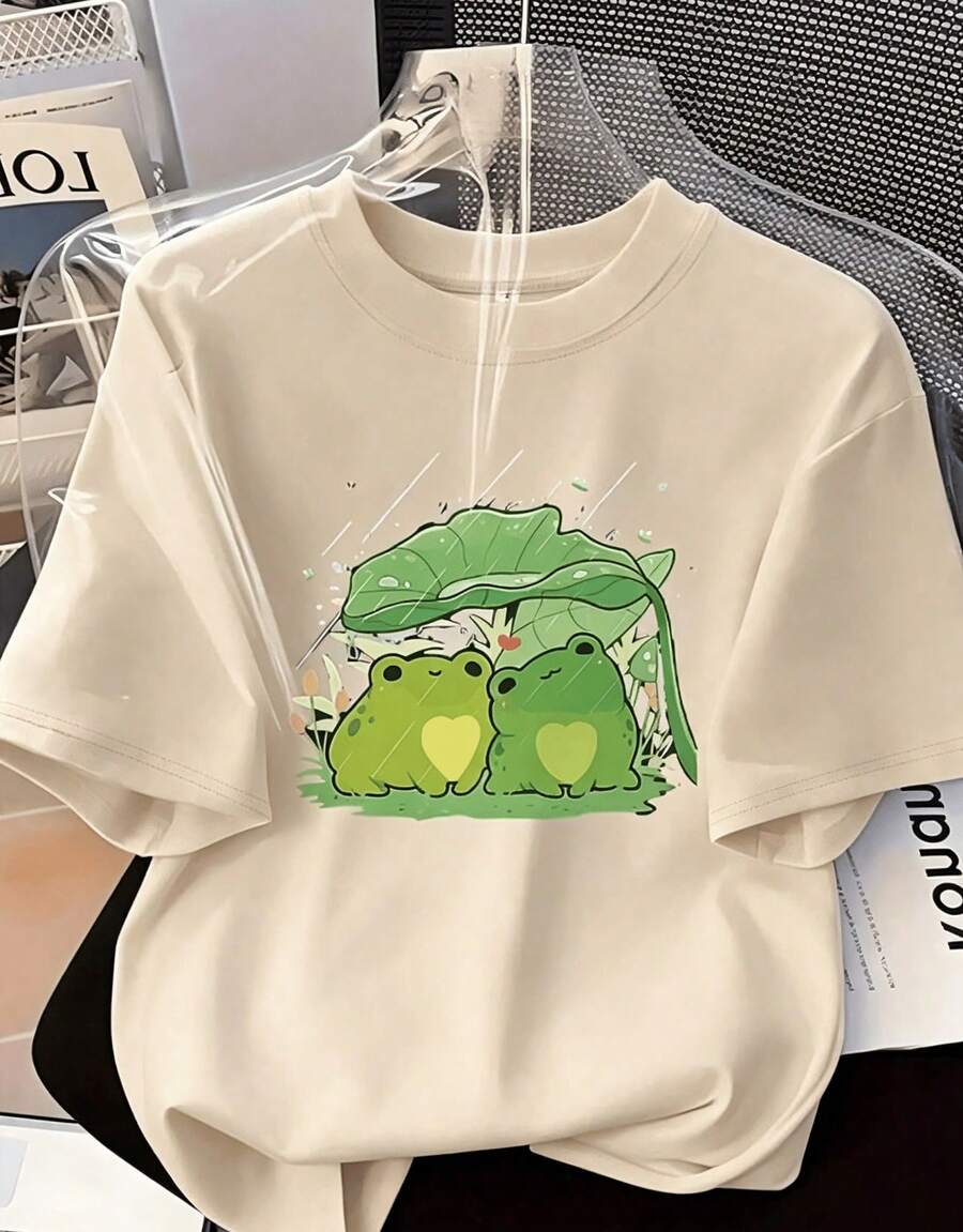 Women's Printed Short-Sleeved T-Shirt Featuring Two Frogs Joined Beneath A Lotus Leaf, Decorated With Hearts. Casual Crew Neck T-Shirt For Women, Suitable For All Seasons - Unisex Loose-Fitting Cotton Short-Sleeved Crew Neck T-Shirt, Long-Sleeved T-Shirt, Perfect For Spring, Casual Tops, Basic T-Shirt, Unisex, For Couples, Men, And Women - 杏色 - 查看 1