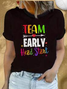 Custom-Designed Short-Sleeve T-Shirt. Team Tee With Colorful Lettering And A Heart And Arrow Design On A Black Background, Rainbow Text, And An Artistic Sun And Moon Pattern, All With A Team And Activities Theme. This Casual Short-Sleeve T-Shirt Features A Crew Neck, Is Soft And Breathable, And Is Suitable For All Seasons. Made From Lightweight Fabric, It Makes A Perfect Christmas Gift. This Sports Tee, Model Y703K, Is A Women's Cotton T-Shirt With A Casual Summer Short-Sleeve Design. - 黑色 - 查看 1
