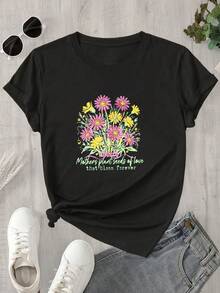 Top de mujer de manga corta y cuello redondo con estampado floral rosa y amarillo, apto para todas las estaciones. - Negro - Ver 1
