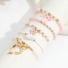5-teiliges Set süßer Y2K-Boho-Armbänder in Rosa mit Perlen, Schleife, Blume und barocker Perle, vergoldet, für den Alltag und Urlaub von Frauen - Typ A - Übersicht 3
