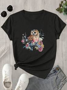 Top de mujer de cuello redondo y manga corta con estampado de búho en acuarela rodeado de flores, apto para todas las estaciones. - Negro - Ver 1