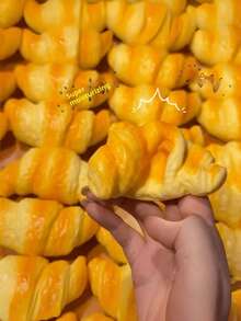 1pc Latest Stress Relief Horn-Shaped Bag, Soft And Malleable, Ultra-Realistic Croissant Design, Creamy Yellow Baked Color, Glossy Burnt Yellow, Realistic Flaky Pastry Texture, Gradient Orange-Yellow, Full Spiral Folds, Gilded Surface, Warm Brown Baked Texture, Fluffy Folds, Creamy Caramelized Color, Buttery Fluffy Texture, Golden Brown Bread Color, Consistent With Baked Product Texture, Baking Style Ins Must-Have, Milky Fragrant Atmosphere, Cute Realistic Dessert - A - View 1