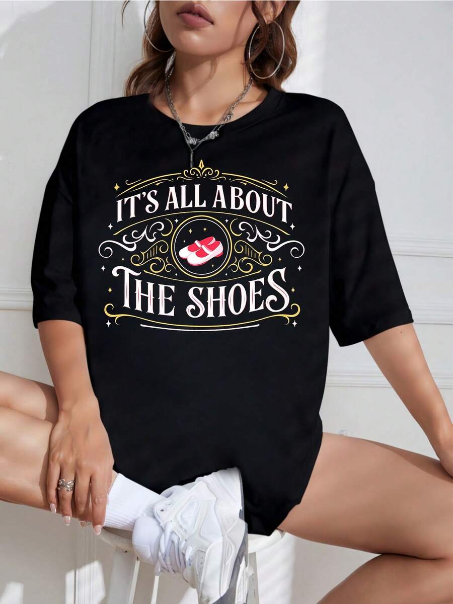 Evil Witch's Magic Castle T-Shirt, It& # "It's All About Shoes" T-Shirt, "The Wizard Of Ozs: Ruby's Slippers" T-Shirt, "Witch's Legs" Retro Graphic T-Shirt For Halloween, New For 2026, "It's All About Shoes: The Wizard Of Ozs" T-Shirt, "Rubie" Retro T-Shirt. - Black - View 1