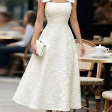 jianchaimaoyi02  Vestido de tela jacquard con textura de loto albaricoque con tirantes, decoración de lazo grande, cintura ceñida, falda acampanada, elegante y grácil, adecuado para regalo de cumpleaños, cita, fiesta, Día del Trabajo, Pascua, boda en el jardín, viaje, casual, trabajo, reunión, Día del Maestro, primavera y verano - Albaricoque - Ver 1