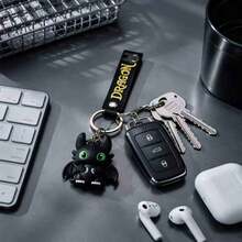 MINISO How To Train Your Dragon Toothless Black Dragon Keychain, Cute Dragon Mini Figure Bag Charm With Black Lettering Webbing And Metal Key Ring, Backpack Handbag Car Key Accessory, Back To School Gift - Style 2 - View 1