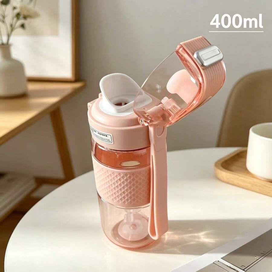 1個翻蓋直飲水壺，專為學生設計，防漏且易於清洗，內建便攜手把，適合學校和戶外露營