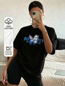 A Stylish And Elegant Black T-Shirt With A Versatile Blue Butterfly Print Design-Perfect For Everyday Wear, Campus Life, Beach Vacations, And Relaxing Moments At Home. - Schwarz - 查看 1