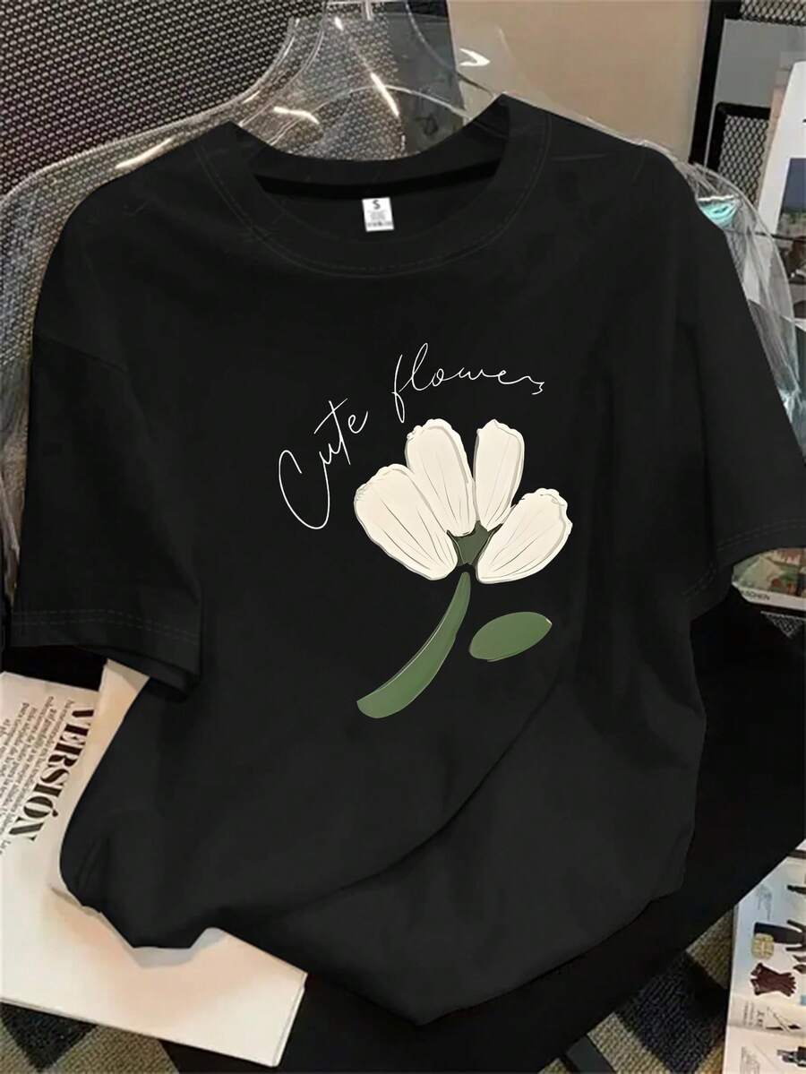 Top de mujer de manga corta y cuello redondo con estampado floral blanco sobre fondo blanco, apto para todas las estaciones. - Negro - Ver 1