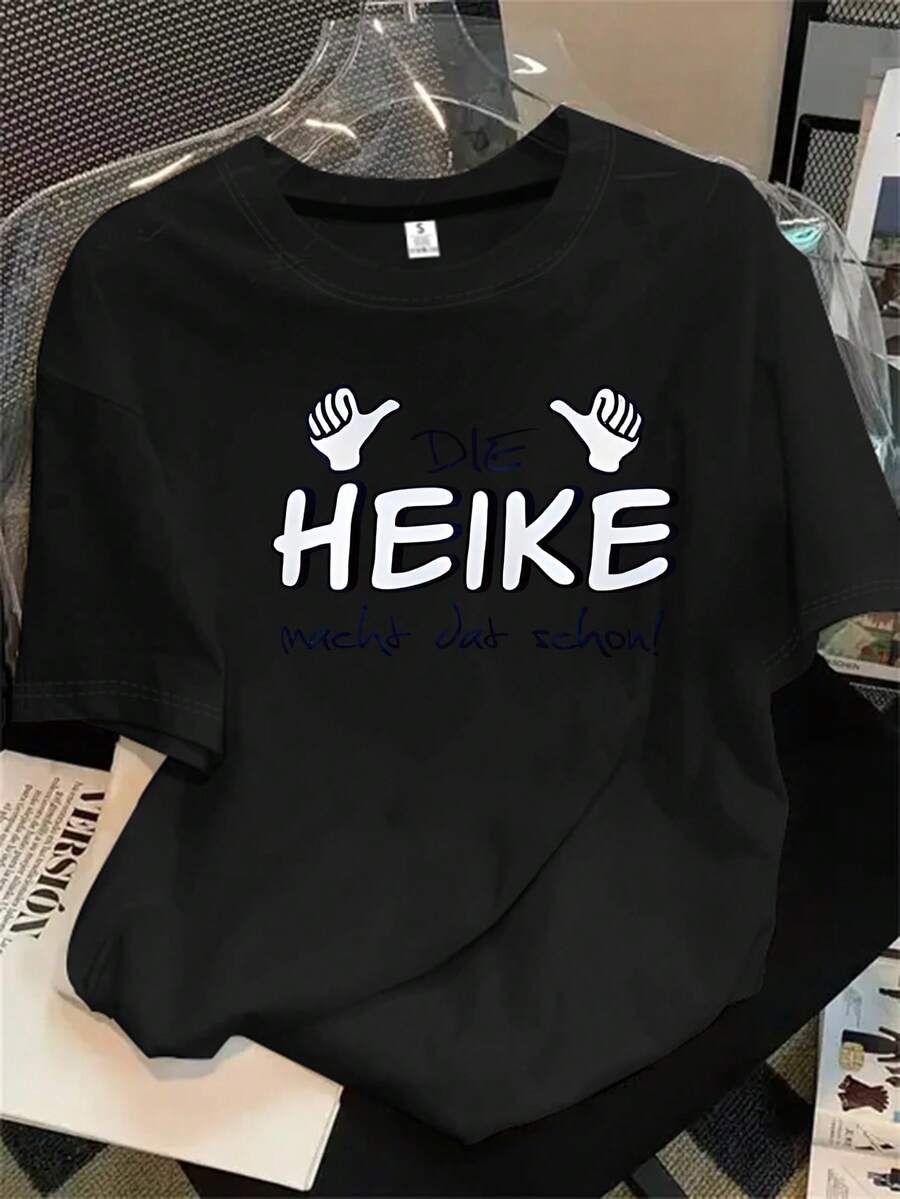 Camiseta de manga corta y cuello redondo para mujer con la palabra "Heke" impresa en tinta negra sobre fondo negro, apta para todas las estaciones. - Negro - Ver 1