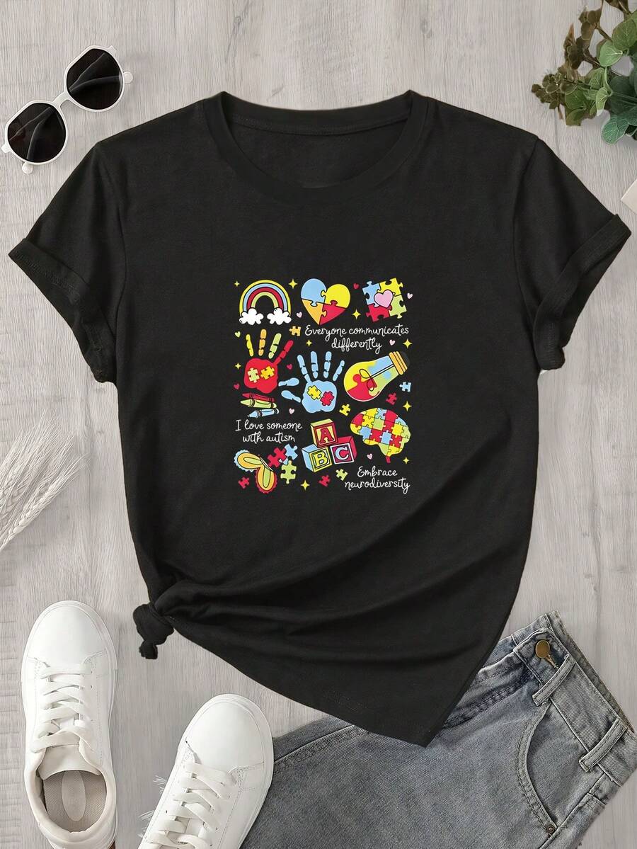 Top de mujer de manga corta y cuello redondo con estampado de retazos coloridos sobre fondo liso, apto para todas las estaciones. - Negro - Ver 1