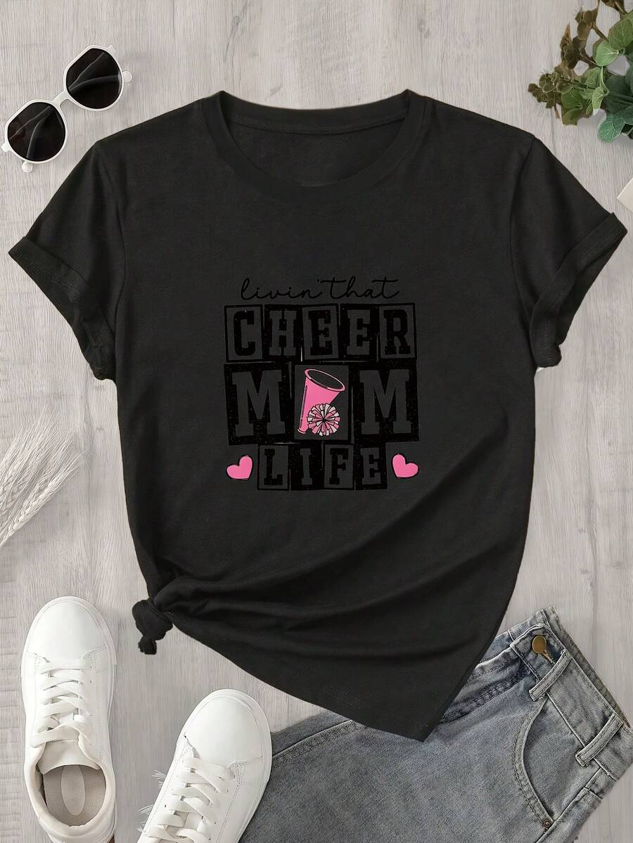 Camiseta de manga corta y cuello redondo para mujer con un estampado que dice "Celebrando la vida de mamá", apta para todas las estaciones. - Negro - Ver 1