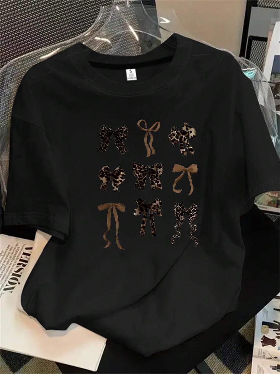 Top de manga corta con cuello redondo y estampado de leopardo con lazo en el pelo para mujer, apto para todas las estaciones. - Negro - Ver 1