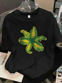 Top de mujer de manga corta y cuello redondo con estampado floral verde y amarillo, apto para todas las estaciones. - Negro - Ver 1