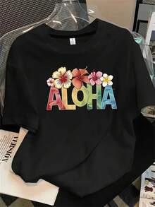 Top de mujer de manga corta y cuello redondo con estampado "Aloha con flores tropicales", apto para todas las estaciones. - Negro - Ver 1