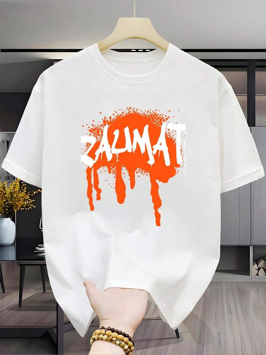 Nueva camiseta casual versátil y elegante para hombre,% algodón, con estampado de manga corta, base negra y diseño artístico con salpicaduras de naranja, estampado de fuente artística blanca, corte holgado, unisex (para hombres y mujeres), material cómodo, para todas las estaciones, perfecta como regalo para vacaciones o cumpleaños. - Blanco - Ver 1