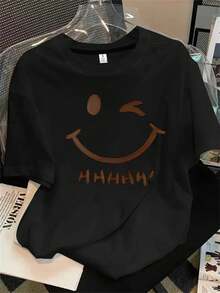Top de mujer de manga corta y cuello redondo con estampado de carita sonriente en metal, apto para todas las estaciones. - Negro - Ver 1