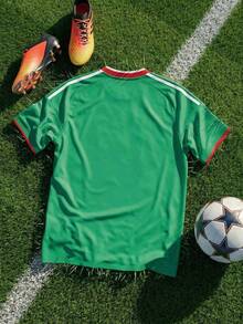 Copa Mundial 2026, Copa Mundial EE. UU.-Canadá-México, Sayu, Novedad, Ropa de hombre, Mascota de la Copa Mundial, Camiseta de manga corta para hombre con temática de la Copa Mundial, Camiseta para hombre, Estampada con un exquisito patrón temático de la Copa Mundial, Jersey, Líneas de hombros, Cuello, Puños, Diseño de bloques de color, Tejido cómodo, Largo regular, Ropa esencial para los partidos de la Copa Mundial, Ropa para eventos - Verde 2 - Ver 2