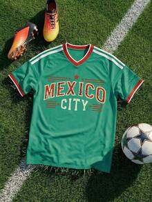 Copa Mundial 2026, Copa Mundial EE. UU.-Canadá-México, Sayu, Novedad, Ropa de hombre, Mascota de la Copa Mundial, Camiseta de manga corta para hombre con temática de la Copa Mundial, Camiseta para hombre, Estampada con un exquisito patrón temático de la Copa Mundial, Jersey, Líneas de hombros, Cuello, Puños, Diseño de bloques de color, Tejido cómodo, Largo regular, Ropa esencial para los partidos de la Copa Mundial, Ropa para eventos - Verde 2 - Ver 1