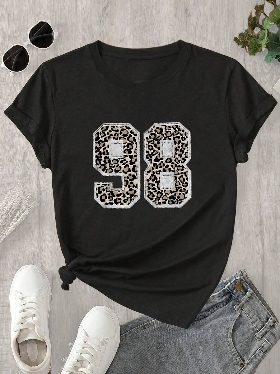 Top de mujer de manga corta y cuello redondo con estampado de vaca, apto para todas las estaciones. - Negro - Ver 1