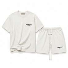 Conjunto de camiseta clásica + pantalones cortos Fear Of God Essentials SS22 en color avena claro, unisex - Juego de avena ligera - Ver 1