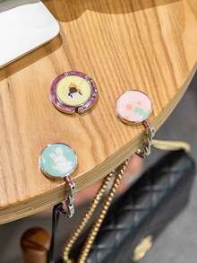 1 pieza Gancho plegable y portátil con diseño de animal de dibujos animados para colgar bolsas, gancho para bolso de mano en el borde de la mesa, herramienta de almacenamiento plegable con gran capacidad de carga para restaurante, cafetería, escritorio, mochila, oficina, dormitorio, adecuado para transportar y uso diario - animal - Ver 3